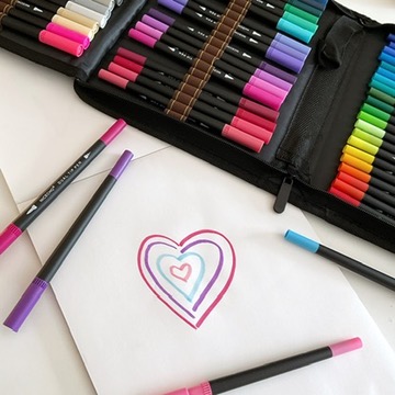 A photo of a drawing of several hearts in concentric circles, drawn in pink and purple markers